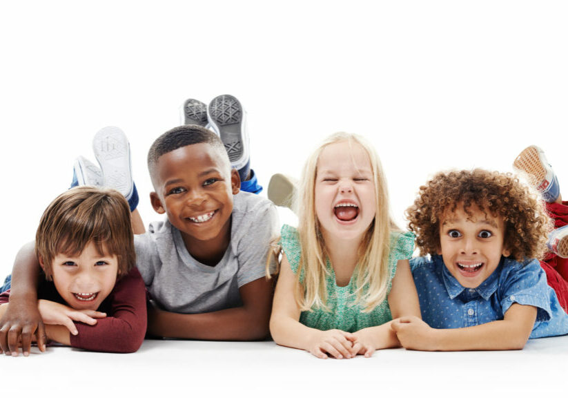 Diversity, portrait of happy children and smiling together in a white background. Happiness or excited, group of friends and multiracial kids and faces have fun, laugh and lay on a isolated studio.